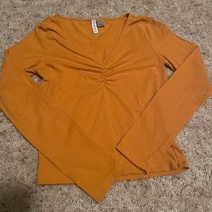 orange scrunch v neck shirt